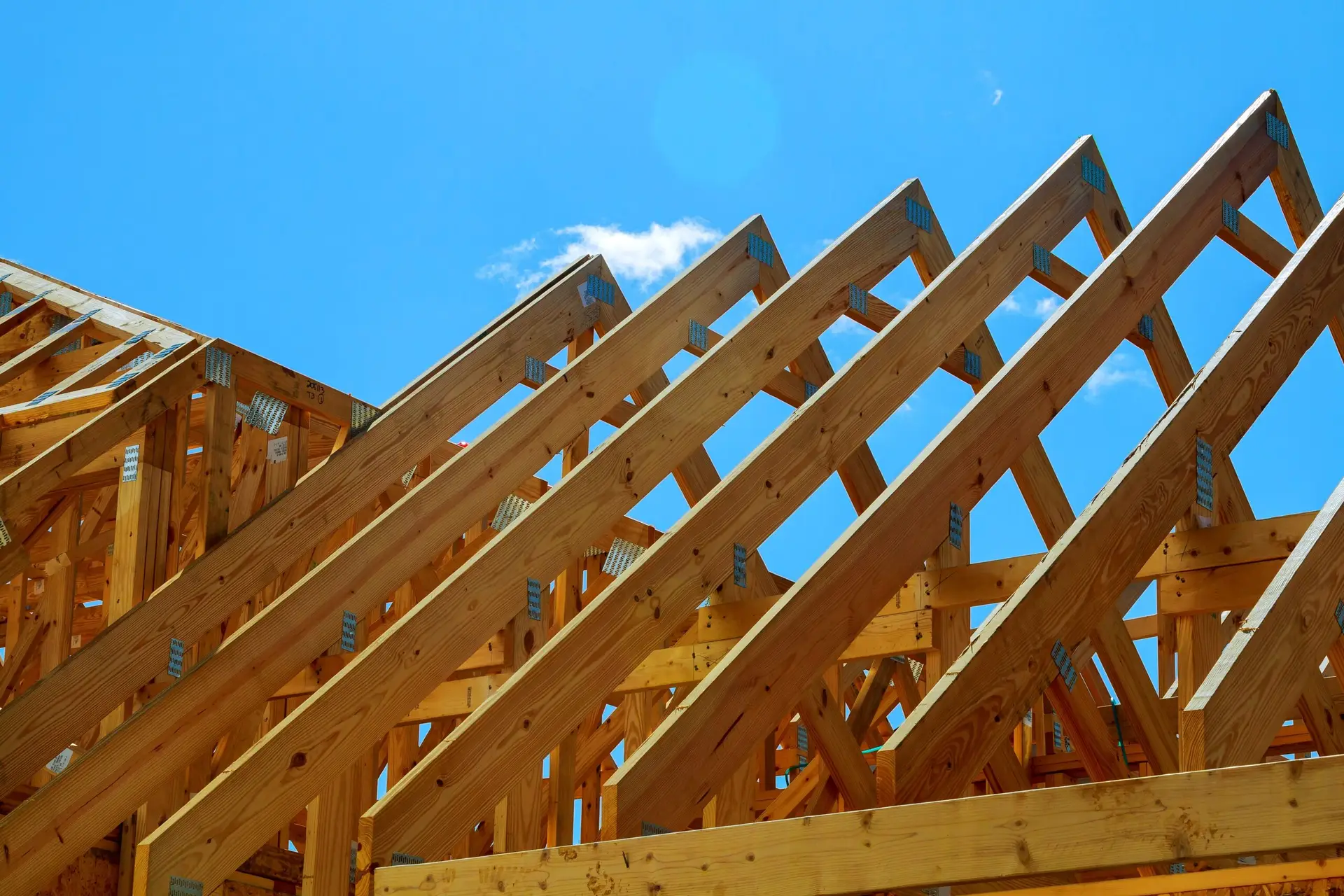 wooden roof construction, symbolic photo for home, house building, and house financing